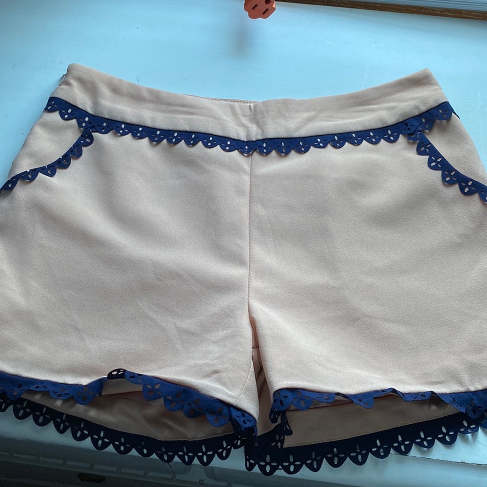 Blush shorts with navy lace type detailing